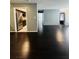 Well-lit living area showcasing hardwood floors, access to the kitchen, and a view of the entry door at 3432 Ivys Walk, Atlanta, GA 30340