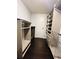 Spacious walk-in closet with built-in shelving units and ample storage on dark wood flooring at 3432 Ivys Walk, Atlanta, GA 30340