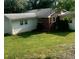 Backyard view of home featuring a well-maintained lawn at 3629 Centerview Dr, Marietta, GA 30066