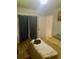 Bedroom with curtained window, bed, and light wood floors at 3629 Centerview Dr, Marietta, GA 30066