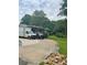 Extended driveway provides ample parking space and easy access to the home with mature trees in background at 3629 Centerview Dr, Marietta, GA 30066