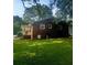 Brick home with a covered side porch and a well-kept lawn, perfect for enjoying the outdoors at 3629 Centerview Dr, Marietta, GA 30066