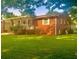 Charming brick home with a covered porch and a spacious front yard perfect for outdoor activities at 3629 Centerview Dr, Marietta, GA 30066