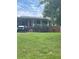 Charming brick house featuring a covered front porch and well-maintained landscaping in quiet neighborhood at 3629 Centerview Dr, Marietta, GA 30066