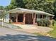 Charming single-story brick home with a covered porch, driveway, and well-maintained landscaping at 3629 Centerview Dr, Marietta, GA 30066