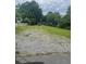 A spacious front yard with parking for multiple cars provides a sense of privacy and room to roam at 3629 Centerview Dr, Marietta, GA 30066