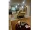 Spacious kitchen area with island, stainless steel appliances and pendant lighting is open to the living area at 3629 Centerview Dr, Marietta, GA 30066