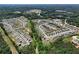 Expansive aerial view of a Primary-planned community surrounded by lush greenery and mature trees at 4255 Sunflower Cir, Cumming, GA 30040