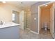 Well-lit bathroom featuring a vanity with sink and an enclosed shower with tile flooring at 4255 Sunflower Cir, Cumming, GA 30040