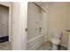Well-lit bathroom with a shower-tub combo and tiled floor at 4255 Sunflower Cir, Cumming, GA 30040