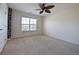 Spacious bedroom with neutral carpet and a ceiling fan at 4255 Sunflower Cir, Cumming, GA 30040