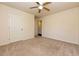 A light filled bedroom with carpet and a view into the hallway and closet at 4255 Sunflower Cir, Cumming, GA 30040