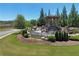 Landscaped entrance with the Bramblett Grove fountain waterfall at 4255 Sunflower Cir, Cumming, GA 30040