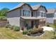 Well-maintained home with stone and siding exterior, lush landscaping, and an attached garage at 4255 Sunflower Cir, Cumming, GA 30040