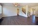 Inviting living room showcasing stairs to upper level and light-filled windows at 4255 Sunflower Cir, Cumming, GA 30040