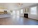 Open floor plan with a kitchen and fireplace that creates a cozy yet functional space at 4255 Sunflower Cir, Cumming, GA 30040