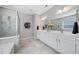 Luxurious bathroom with double vanity, modern fixtures, and walk-in shower provides a spa-like experience at 495 Duval Dr, Alpharetta, GA 30009