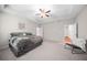 Inviting bedroom features tray ceiling, ceiling fan, plush carpet, and ample natural light for a cozy ambiance at 495 Duval Dr, Alpharetta, GA 30009