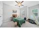 Cozy bedroom with carpet, features a ceiling fan, a bed, tent, and a moose art piece on the wall at 495 Duval Dr, Alpharetta, GA 30009