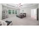 Spacious bedroom with tray ceiling, fan, and plenty of natural light offers a comfortable retreat at 495 Duval Dr, Alpharetta, GA 30009