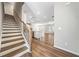 Entryway featuring hardwood floors and stairs leading to the upper level at 495 Duval Dr, Alpharetta, GA 30009