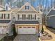 Beautiful two-story townhome with a two-car garage and charming architectural details at 495 Duval Dr, Alpharetta, GA 30009