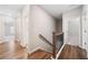 Upstairs hallway with hardwood floors and neutral walls connects to bedrooms and bathrooms with great flow at 495 Duval Dr, Alpharetta, GA 30009