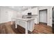 Well-appointed kitchen featuring a granite island, modern appliances, and ample cabinet space at 495 Duval Dr, Alpharetta, GA 30009