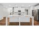 Spacious kitchen island with stainless appliances and pristine cabinets at 495 Duval Dr, Alpharetta, GA 30009