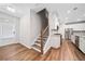 Bright, open kitchen with modern stainless steel appliances and wood flooring at 495 Duval Dr, Alpharetta, GA 30009