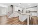 Spacious kitchen with a central island, stainless steel appliances, and hardwood floors at 495 Duval Dr, Alpharetta, GA 30009