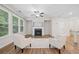 Inviting living room featuring a modern fireplace, neutral walls, contemporary seating, and natural light at 495 Duval Dr, Alpharetta, GA 30009