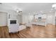 Bright open floorplan showcasing a kitchen, living room with fireplace, and modern flooring at 495 Duval Dr, Alpharetta, GA 30009