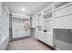 Well-organized walk-in closet with custom shelving and hanging rods provides ample storage and simplifies wardrobe management at 495 Duval Dr, Alpharetta, GA 30009