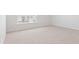 Spacious bedroom featuring plush carpeting, white walls, and a window providing ample natural light at 6123 Knickerbocker St, Mableton, GA 30127