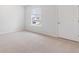 Cozy bedroom with a window and soft carpeting; perfect for relaxation and rest at 6123 Knickerbocker St, Mableton, GA 30127