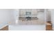 Modern kitchen features a large island, granite countertops, stainless steel appliances, and ample storage at 6123 Knickerbocker St, Mableton, GA 30127