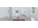 Bright and airy living room with hardwood floors, neutral walls, and sliding glass doors leading to the outdoor space at 6123 Knickerbocker St, Mableton, GA 30127