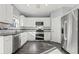 Well-lit kitchen featuring stainless steel appliances, modern cabinets, and stylish countertops at 1332 Adcox Sq, Stone Mountain, GA 30088