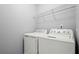 Bright laundry room with white washer and dryer at 1332 Adcox Sq, Stone Mountain, GA 30088