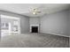 Open concept living room showcasing a cozy fireplace and seamless transition to the dining area at 1332 Adcox Sq, Stone Mountain, GA 30088