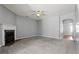 Spacious living room with fireplace, ceiling fan, and neutral decor for comfortable living at 1332 Adcox Sq, Stone Mountain, GA 30088