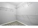 Empty walk-in closet with wire shelving and neutral carpet at 1332 Adcox Sq, Stone Mountain, GA 30088