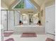 Elegant bathroom featuring a soaking tub, glass-enclosed shower, and large window at 283 Heron Lake Ct, Lawrenceville, GA 30043