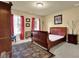Cozy bedroom with a large bed, matching furniture, and plush carpeting at 283 Heron Lake Ct, Lawrenceville, GA 30043