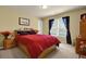 Comfortable bedroom with natural light and neutral decor at 283 Heron Lake Ct, Lawrenceville, GA 30043