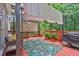Outdoor deck featuring a retractable shade cover, outdoor seating, and a grill, creating a perfect space for entertaining at 283 Heron Lake Ct, Lawrenceville, GA 30043