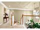 Bright hallway features neutral colors, decorative accents, and stairway to the upper level at 283 Heron Lake Ct, Lawrenceville, GA 30043