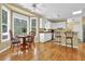 Bright kitchen with breakfast area and ample natural light from large windows at 283 Heron Lake Ct, Lawrenceville, GA 30043
