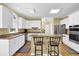 Well-equipped kitchen featuring white cabinets, granite countertops, and stainless steel appliances at 283 Heron Lake Ct, Lawrenceville, GA 30043